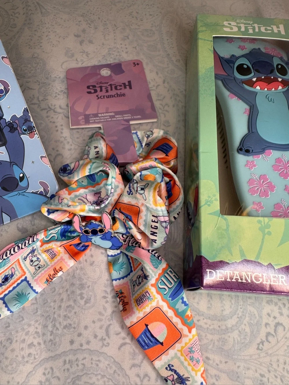 Disney Stitch Scalp Massager, Detangler Brush, and Metal Stich on Satin Scrunch